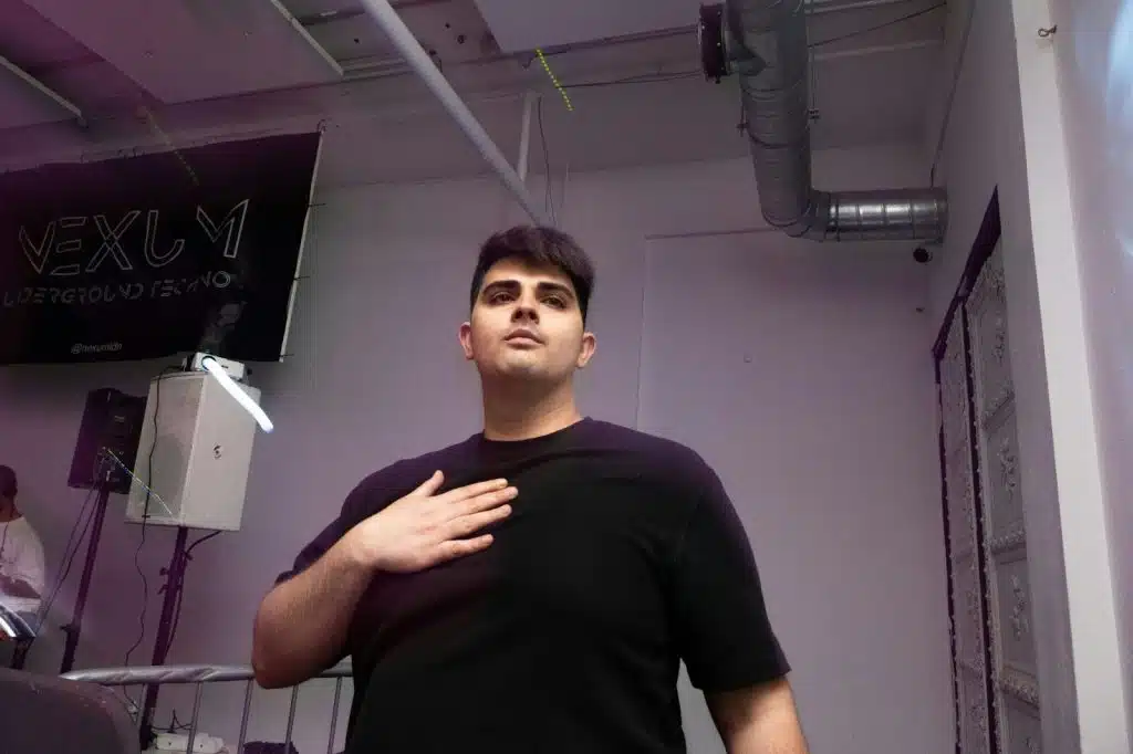 A man holding his chest.
