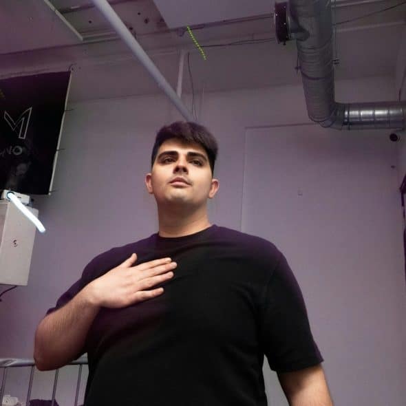 A man holding his chest.