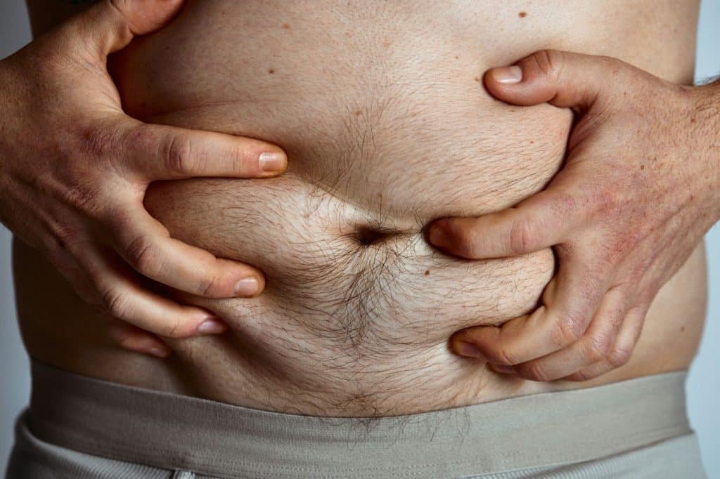 A man holding his stomach.