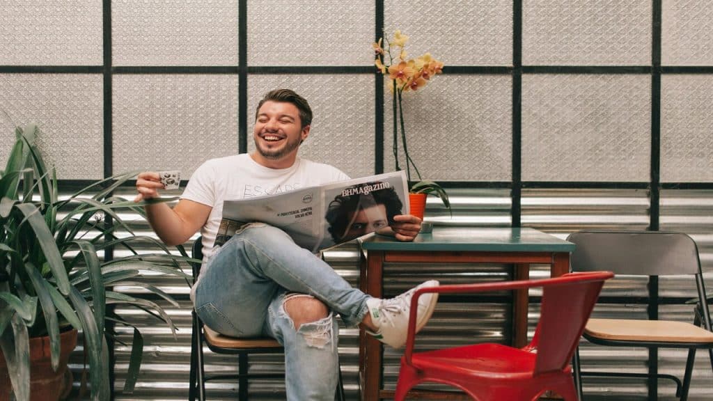 A man smiling by himself.