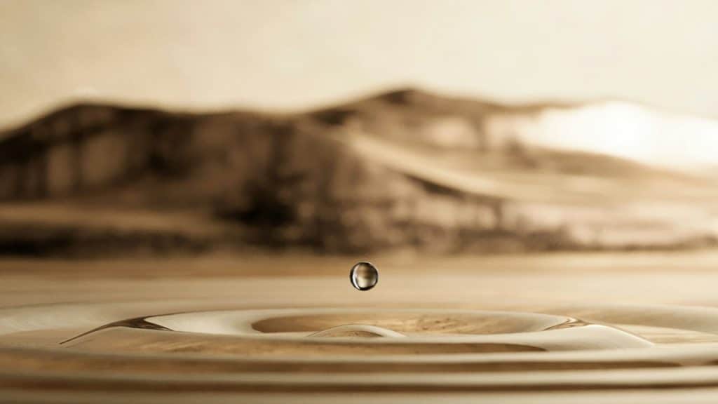 A drop of water making waves.