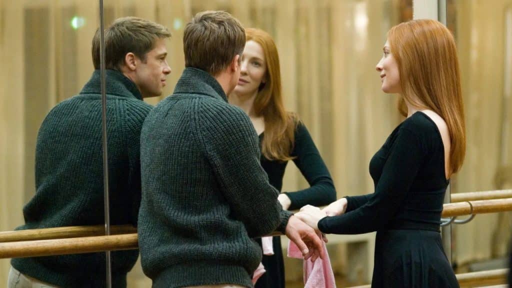 A man and a woman at a dance studio.