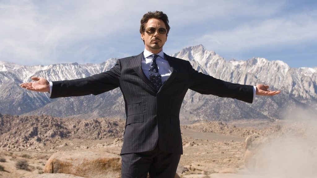 Tony Stark showing some soldiers his weapons.
