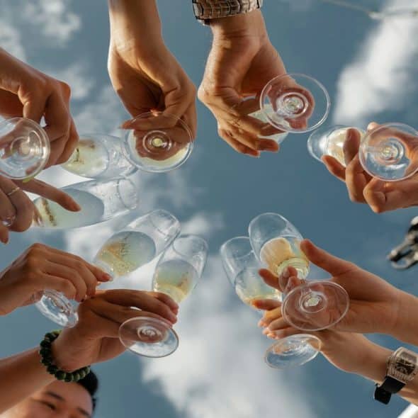 People holding glasses of champagne