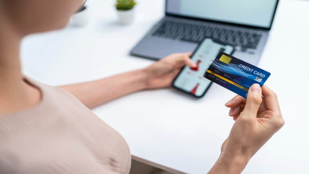 A woman looking at her credit card
