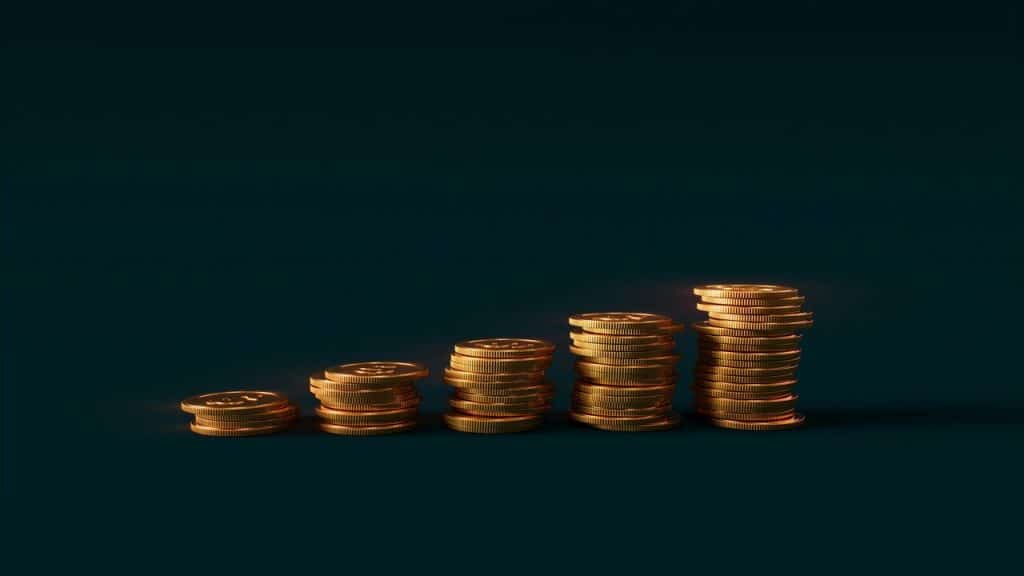 A stack of gold coins growing over time 