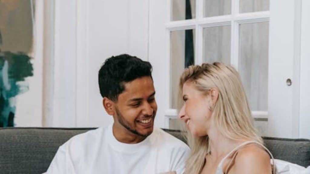 Man and woman having an open hearted conversation in a cozy living room
