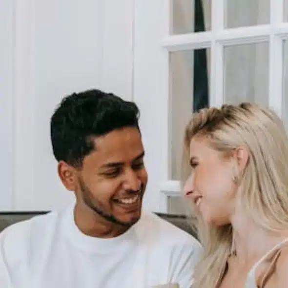 Man and woman having an open hearted conversation in a cozy living room