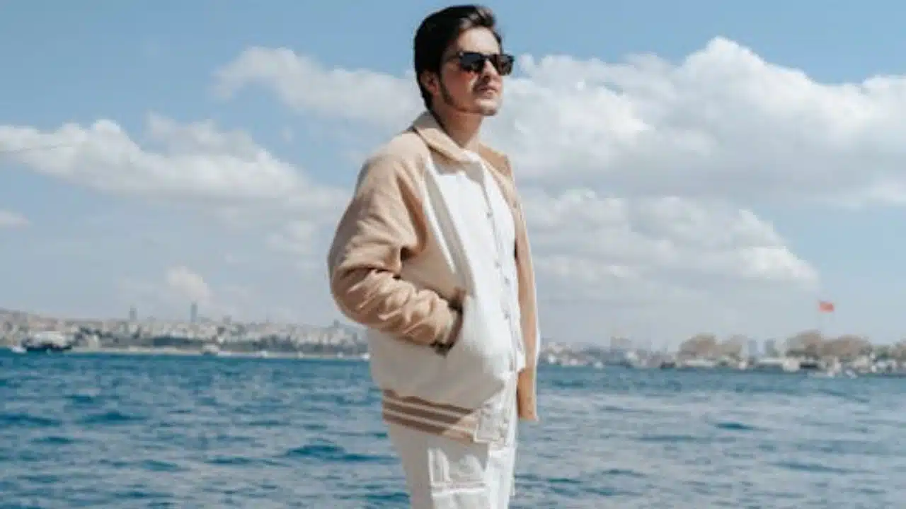 Man standing confidently alone, representing emotional strength and maturity.