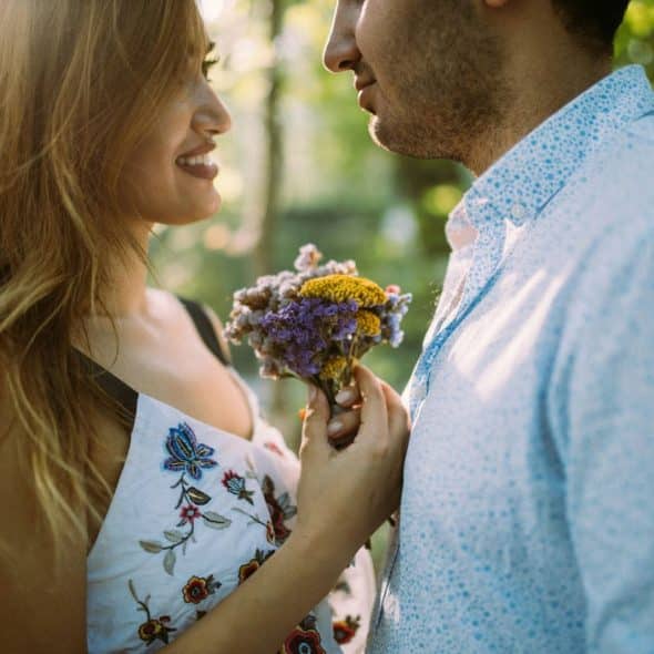 A picture of a man and woman facing each other.