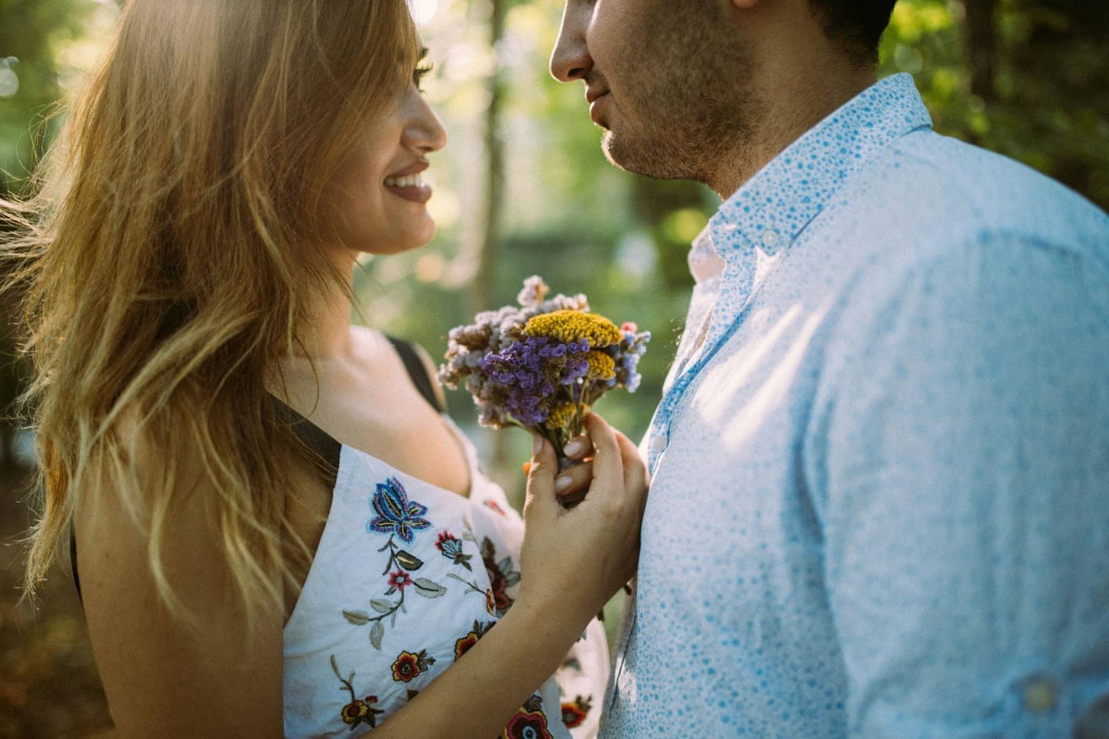 A picture of a man and woman facing each other.