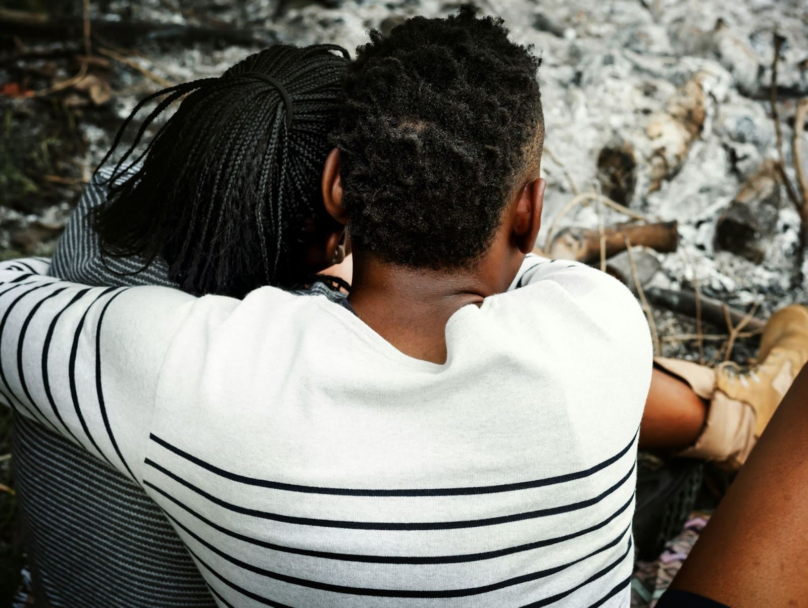 A man hugging a woman.