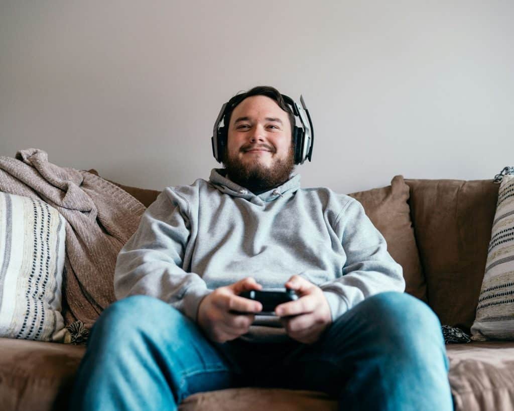A man looks happy playing a game.