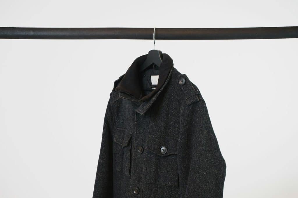 A picture of one coat hanging.