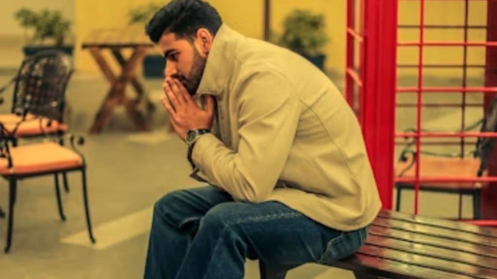 A man looks discouraged after being dismissed during a conversation.