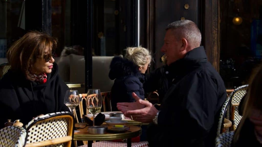 Middle aged man having an honest conversation across a dinner table.