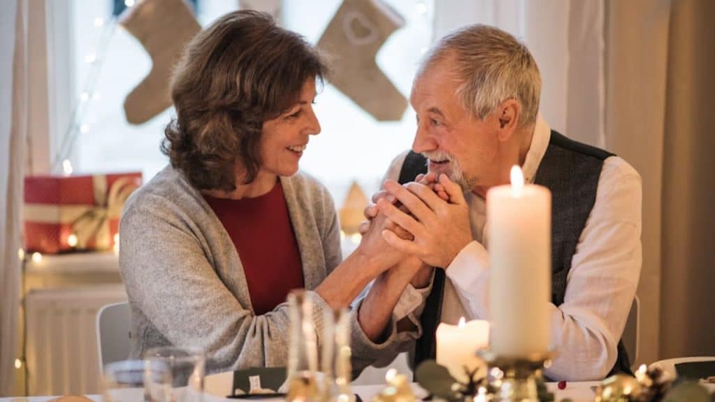 Older man enthusiastically sharing a story on a dinner date.