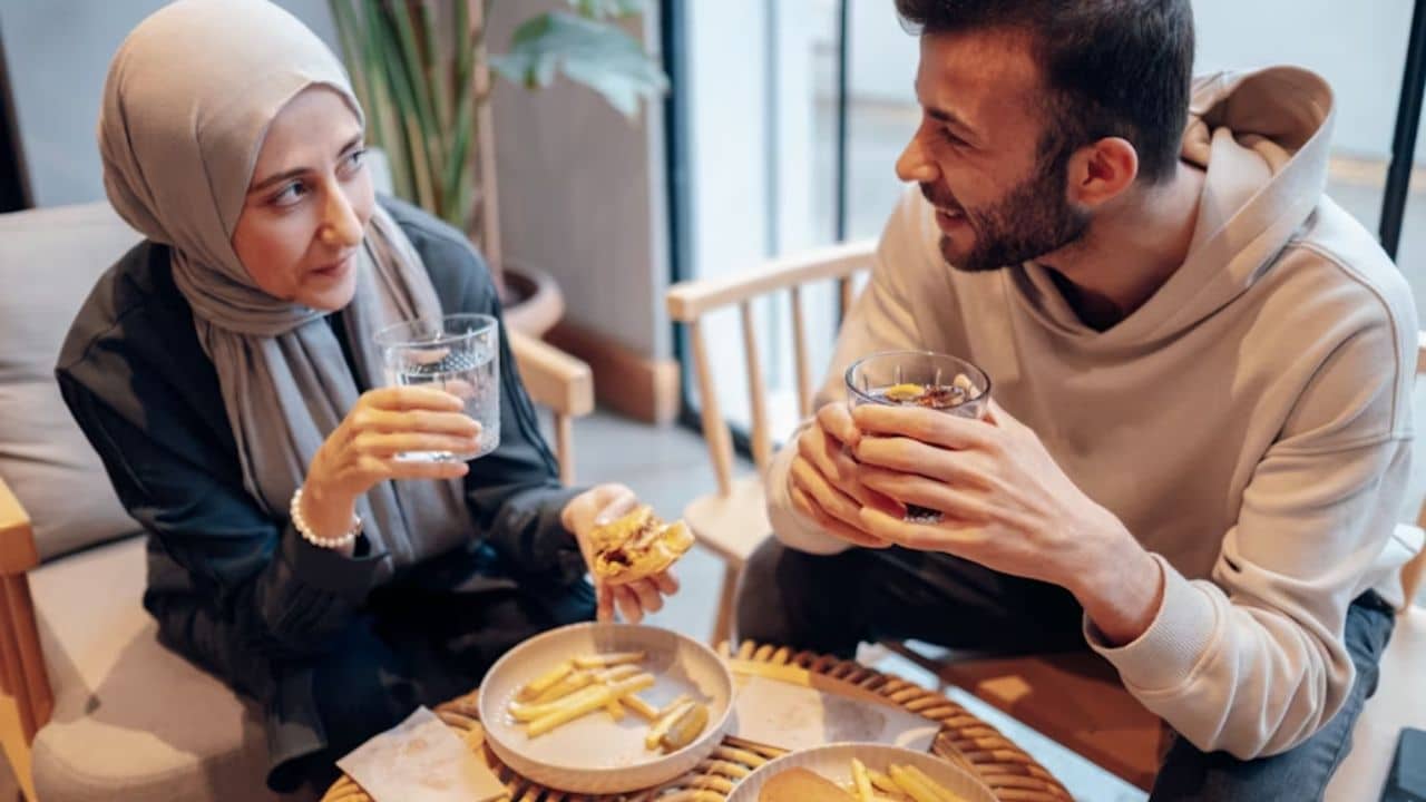 A couple having a serious conversation in a café.