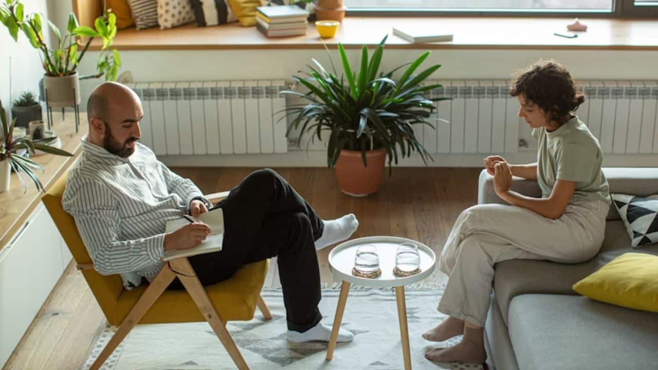 A couple sitting quietly after a disagreement.