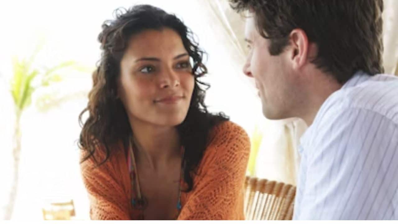 A man calmly responding during a sensitive conversation.