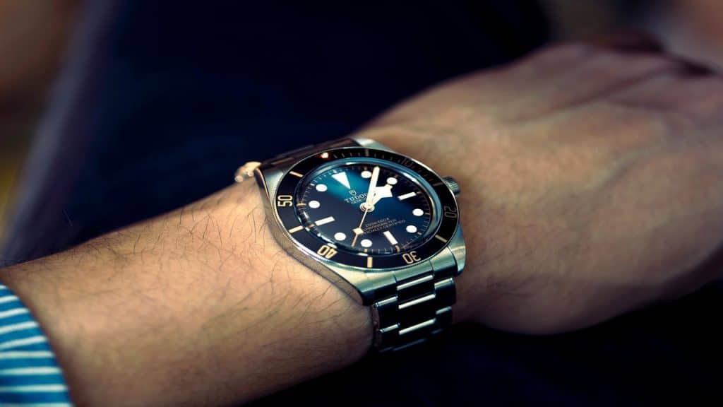 A watch sitting on a man’s wrist.