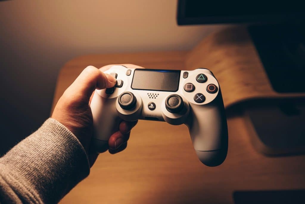 A picture of hand clicking a game controller
