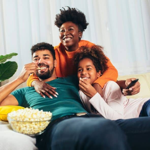 A happy family watching movie