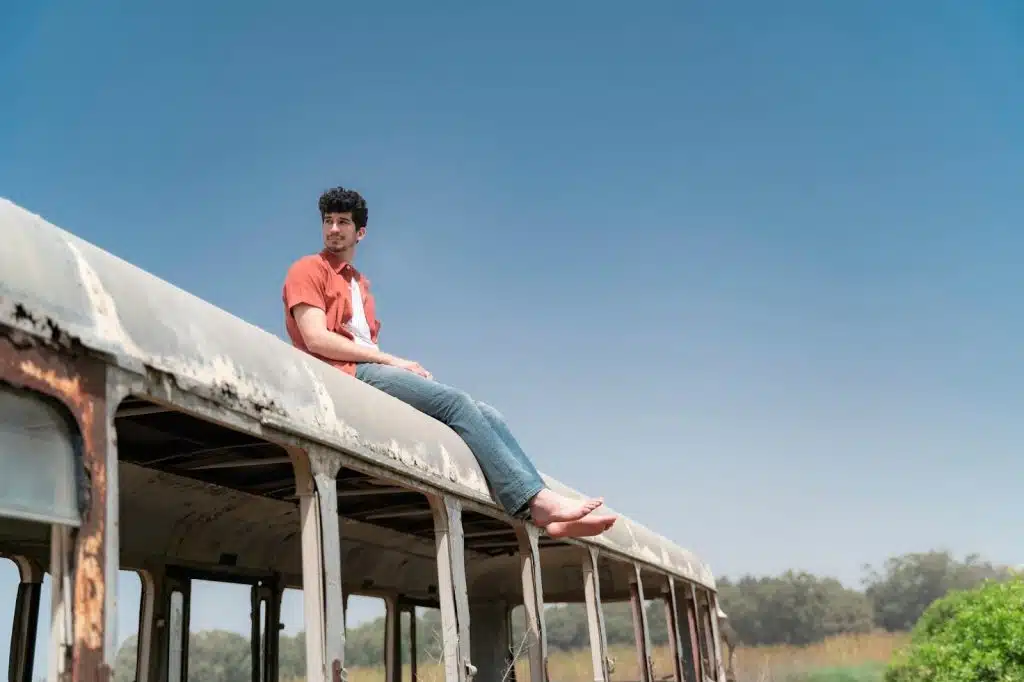 A man sitting on a roof of old coaster