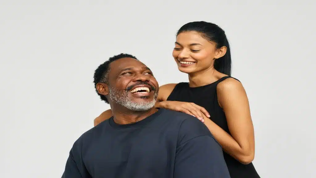A couple smiling at each other.