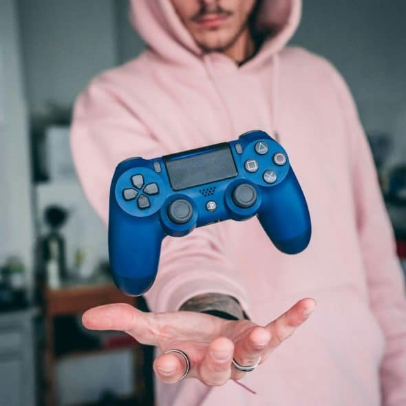 A man with a floating controller
