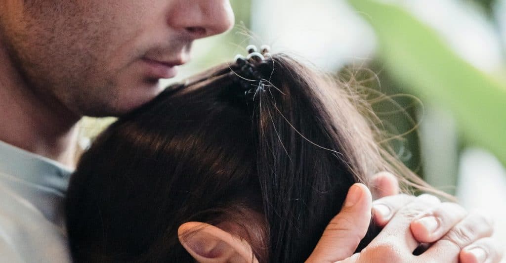 A partner offers calm, quiet support while listening to their significant other open up emotionally.