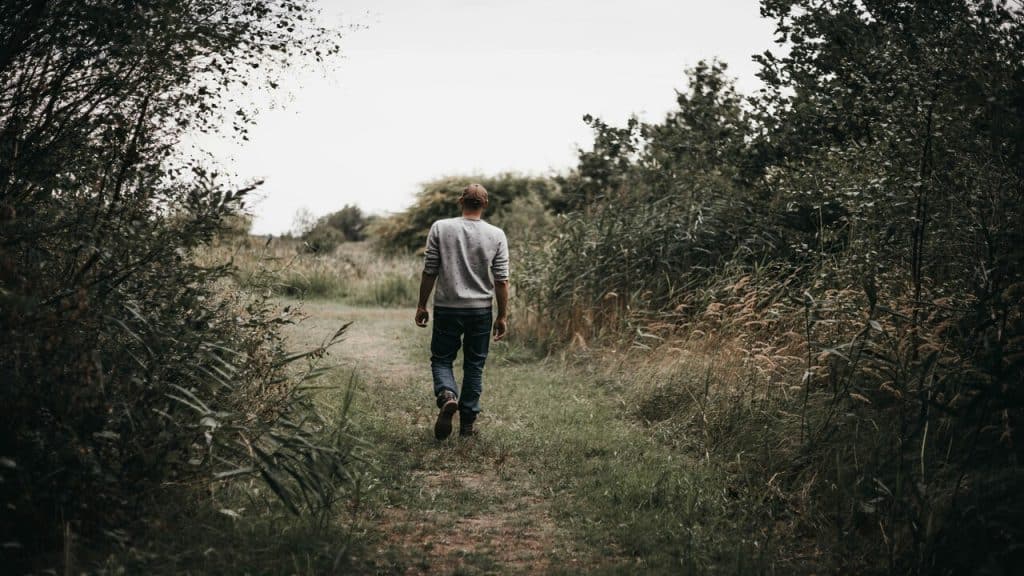 A man walking away by himself