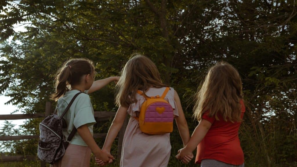 Three kids walking together