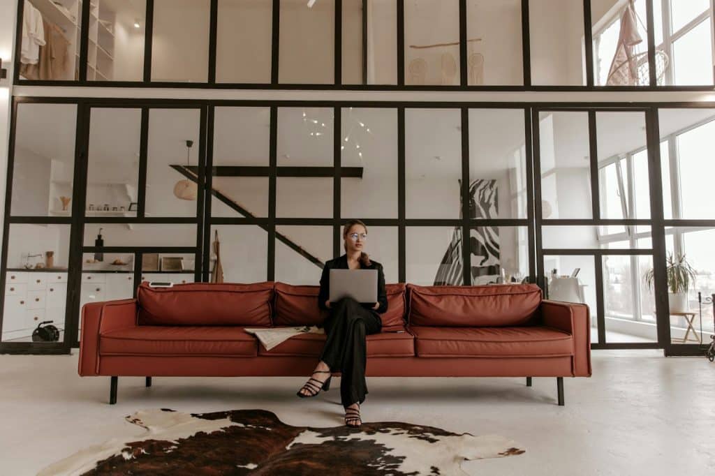 A woman sitting on a red couch