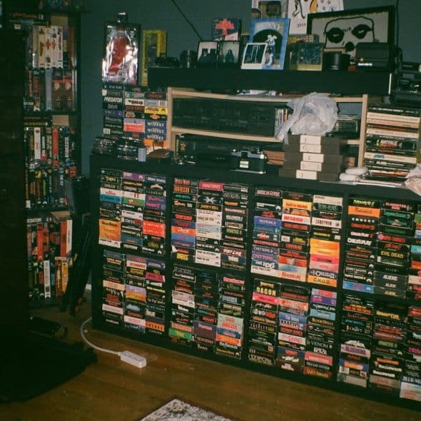A cabinet that is full of video game cds