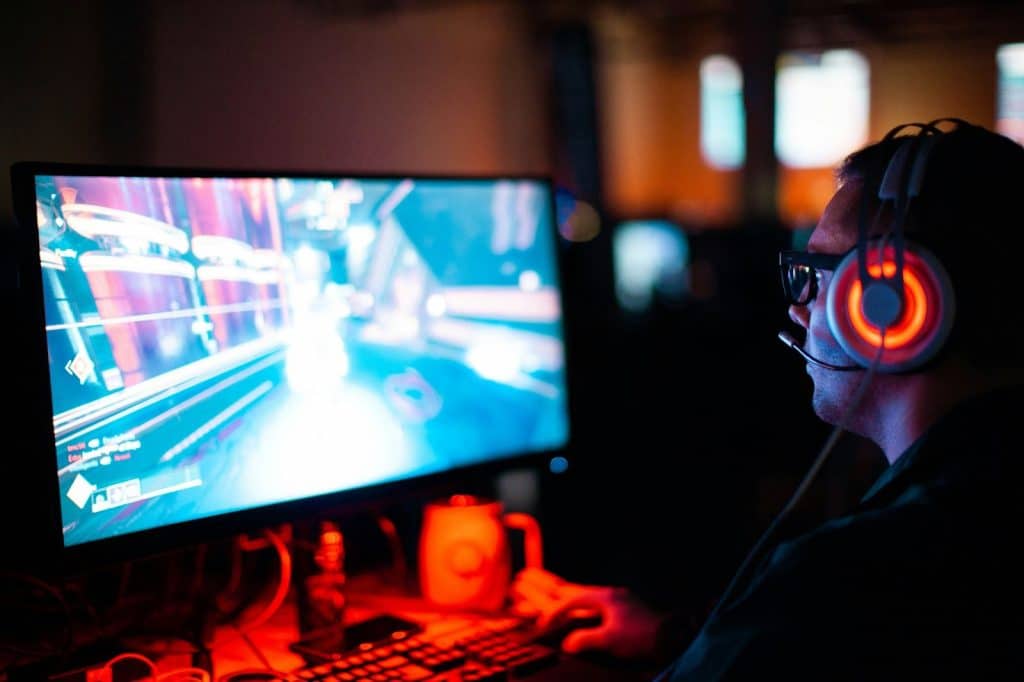 A picture of a guy playing pc games