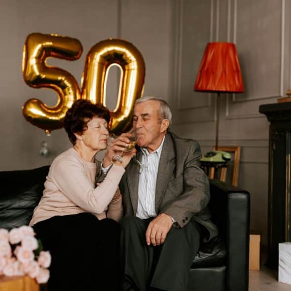 A married couple celebrating their 50th wedding anniversary