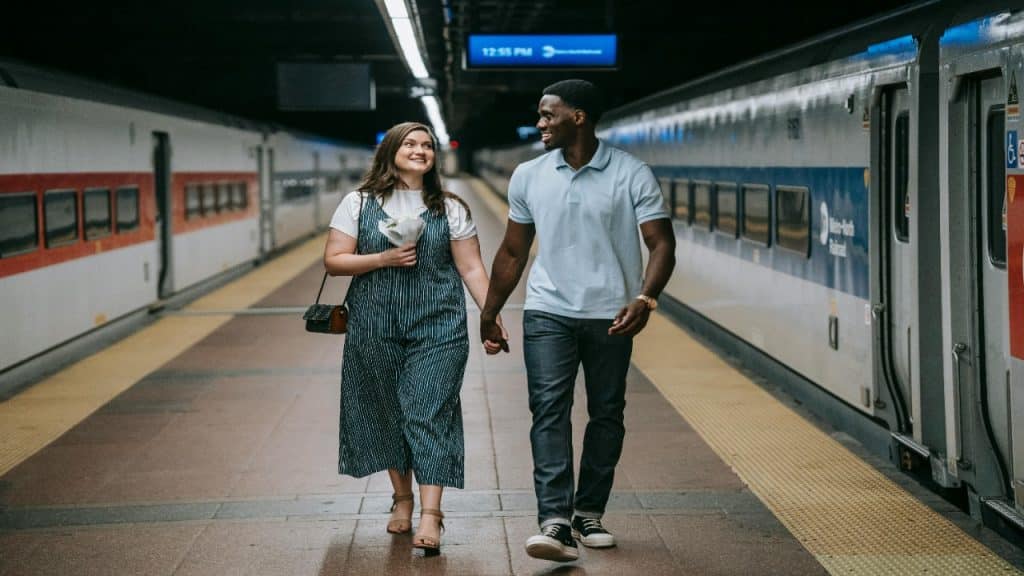 A couple walking together in the city, showing ease and comfort built through mutual trust.