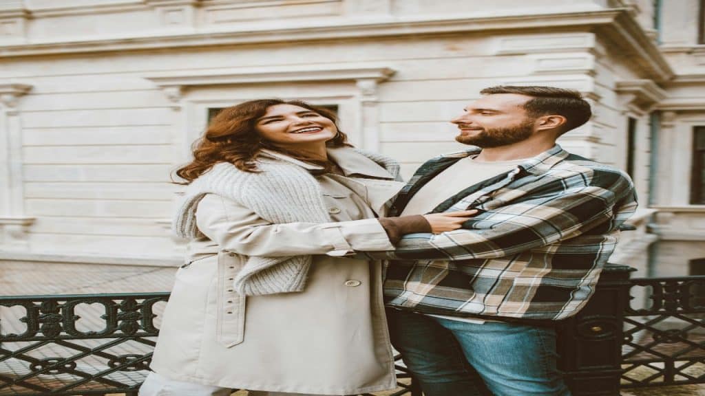 A woman manages household responsibilities alone while her partner remains unaware and uninvolved.