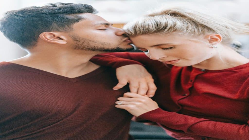 A couple shares a loving embrace, built on trust, communication, and emotional intelligence.