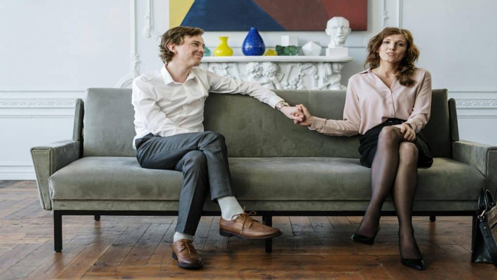 A couple speaks with emotional clarity and composure during a deep conversation.