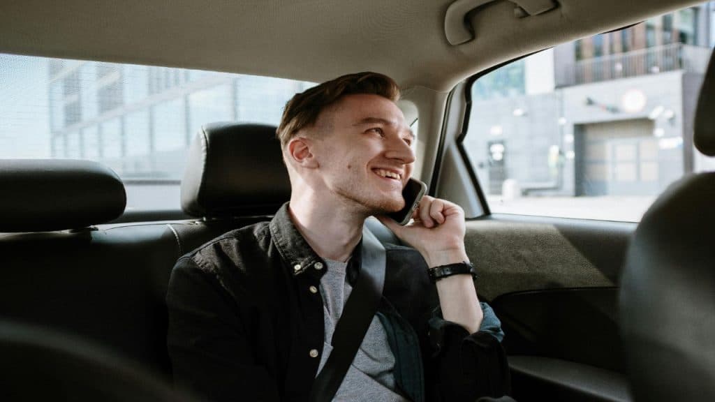A man talking with a friend over the phone setting boundaries and building emotional confidence.