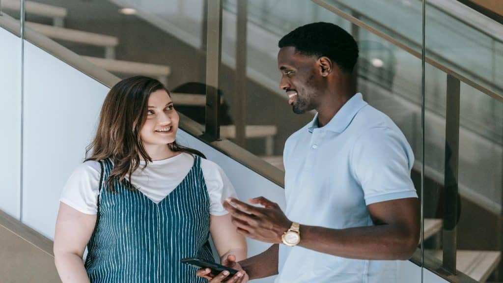 A man talking to a friend setting a firm but respectful boundary in conversation.