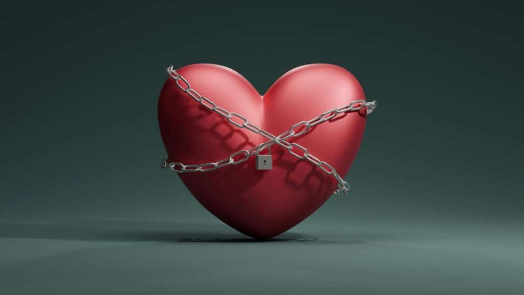 A red heart with lock and chains