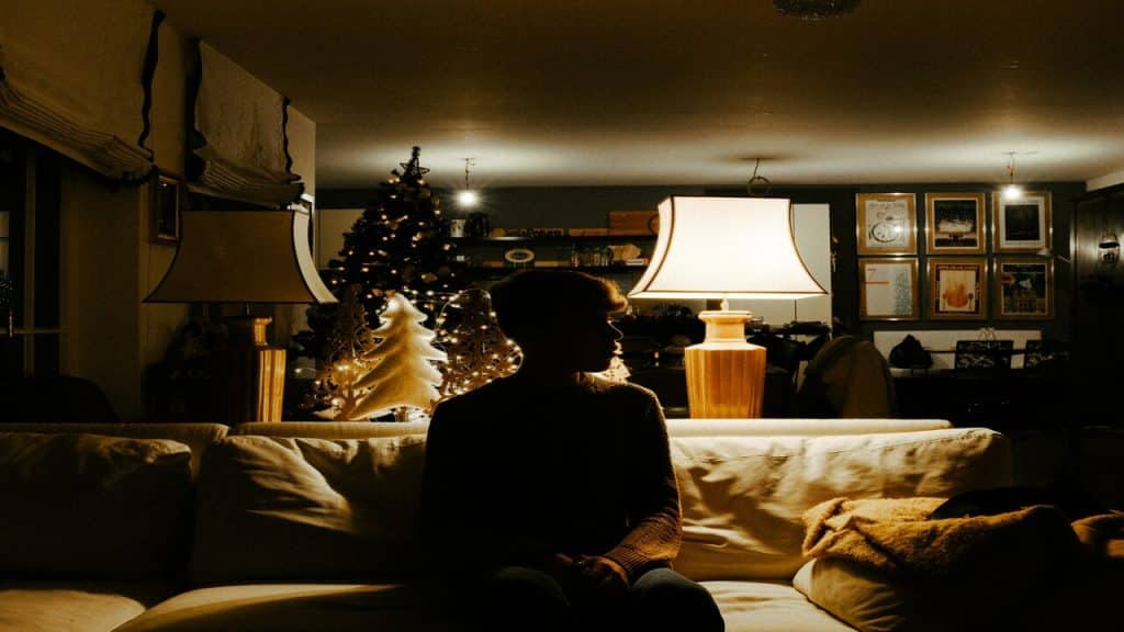Man sitting in the dark alone.