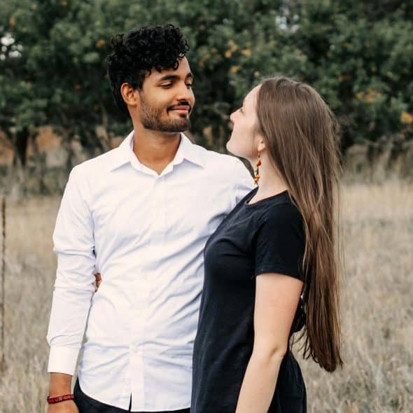 A man and woman looking at each other.