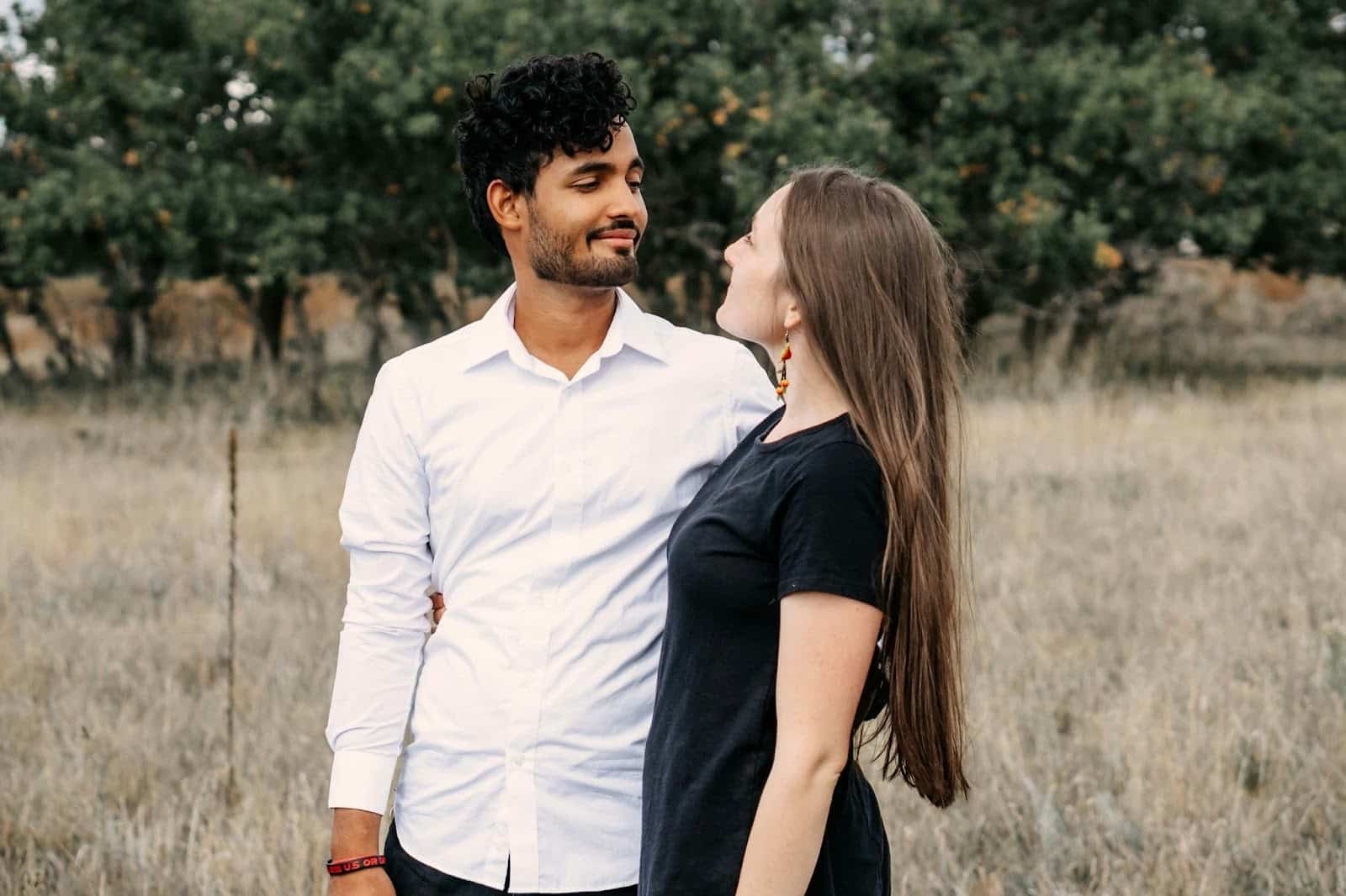 A man and woman looking at each other.