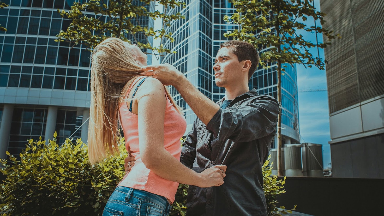 A man touching woman’s hair.