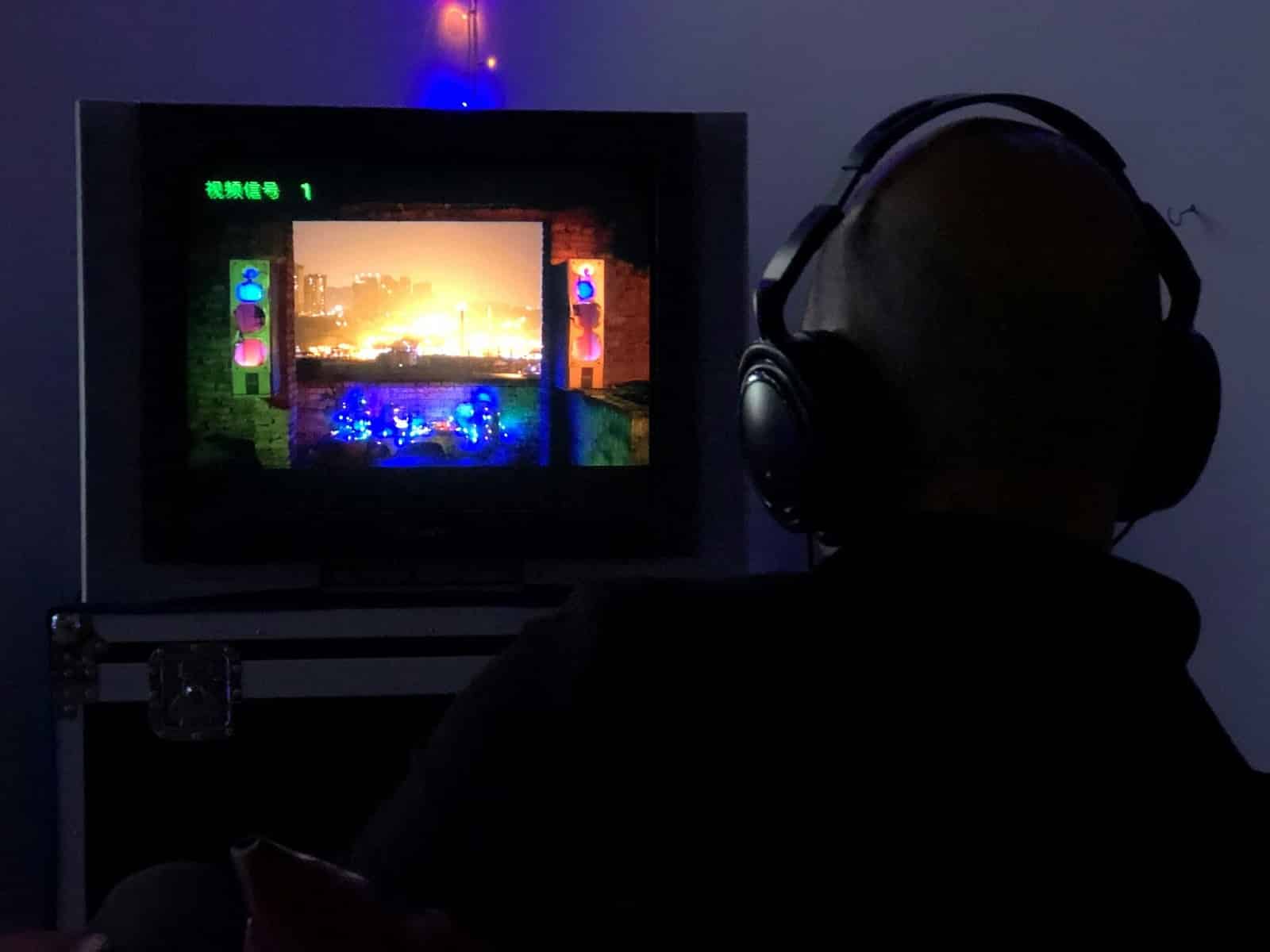 A man playing with headphones.