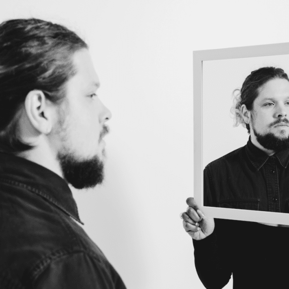 A man looking at a picture of himself